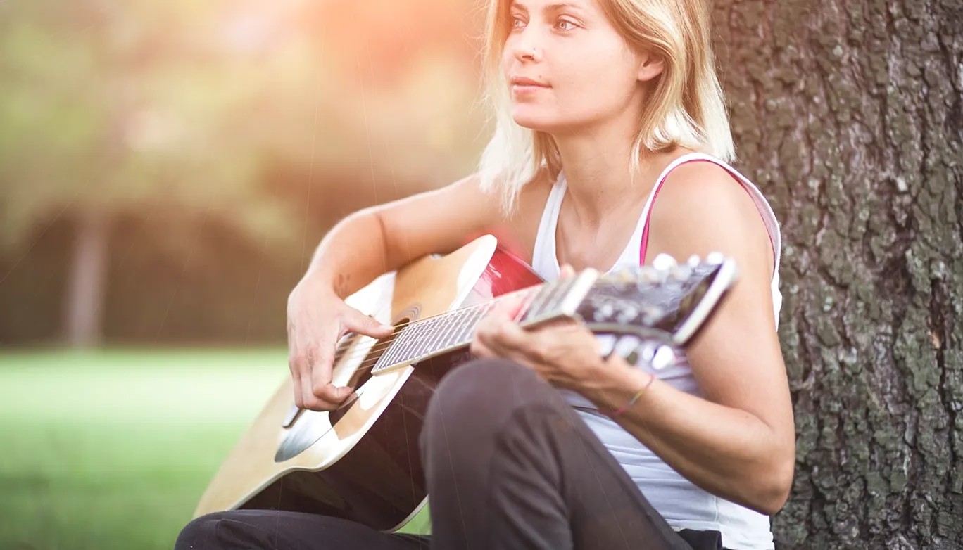 Guitar, guitarist and girl